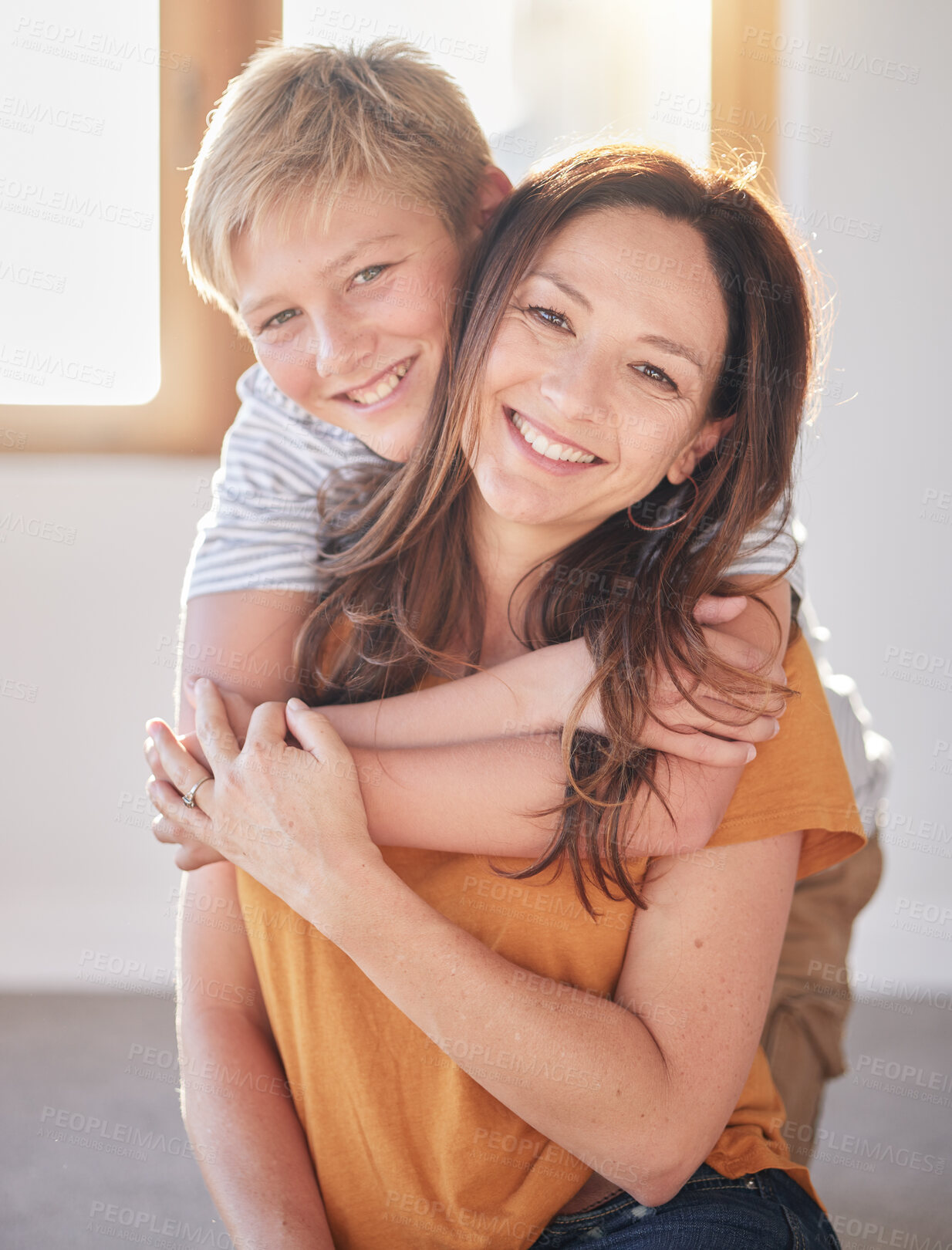 Buy stock photo Mother, hug and kid in a family home together with happiness, bonding and parent care. Portrait of a mom and child in a house with love and happy child care smiling and hugging in a living room