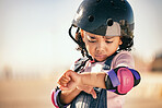 Cycling injury, child and pain from a bike accident outdoor feeling stress and sadness. Young girl busy with summer cyclist or skating activity with a helmet and safety gear with arm bruise problem