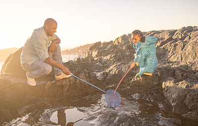 Buy stock photo Fishing net, dad and kid, beach and ocean for learning, development and growth, summer holiday adventure and travel freedom. Happy girl child catch fish with parent in sea, nature and rock pool water