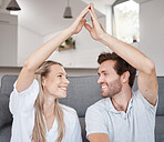 Couple, roof hands and happy together on floor in bedroom of new home, safety insurance and happiness in family home. Marriage, security and protection support for love, care and house mortgage 