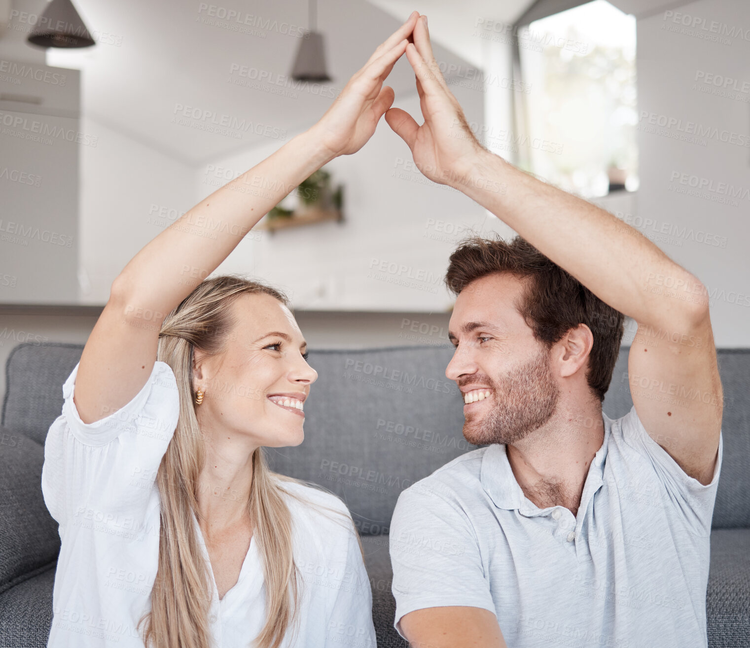 Buy stock photo Couple, roof hands and happy together on floor in bedroom of new home, safety insurance and happiness in family home. Marriage, security and protection support for love, care and house mortgage 