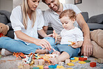 Family, toys and play, development and bonding with parents and child playing together on living room floor. Growth, childhood toy and love with happy family, mother and father with baby and relax.