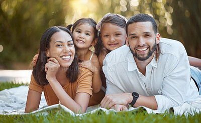 Buy stock photo Family, portait and garden with a man and woman bonding with their little girl kids in summer. Nature, park and mother, father and daughter, sister and siblings relaxing on the grass for love bond