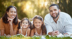 Garden, happy family and couple with children on blanket in park for summer picnic and family time together. Nature, love and relax on grass, portrait of man, woman and girl kids with smile in sun.