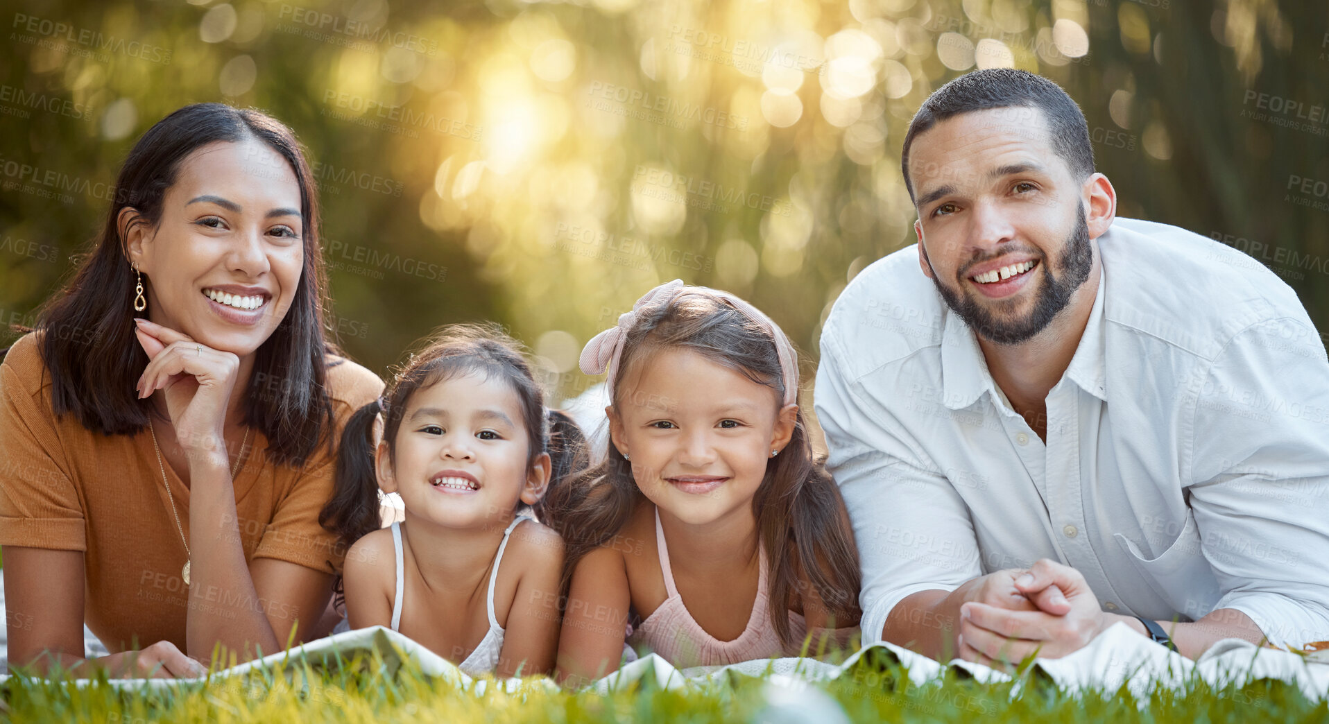Buy stock photo Garden, happy family and couple with children on blanket in park for summer picnic and family time together. Nature, love and relax on grass, portrait of man, woman and girl kids with smile in sun.