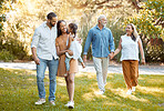 Big Family, girl and walking in nature park for bonding, fun and care in summer outdoor. Mother, father and grandparents walk with child, happy and smile in a garden or forest with love and happiness