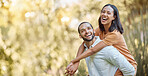 Summer, park and man piggyback woman enjoying freedom, holiday and vacation in nature together. Love, affection and happy black couple bonding, spend quality time and laughing on weekend in forest