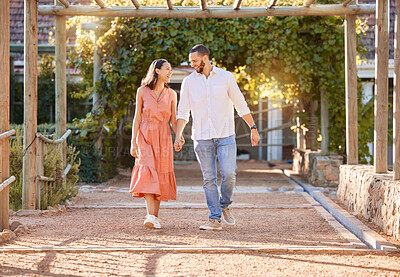 Buy stock photo Love, date and couple holding hands in a park for trust, support and communication in summer. Happy, walking and man and woman with affection and smile on a romantic holiday after marriage in nature