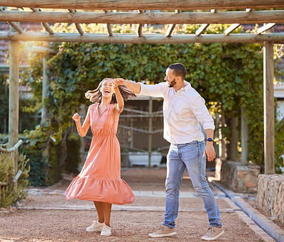 Buy stock photo Couple, happy dancing together and outdoor love to celebrate relationship, cute dance spin and relationship activity. Woman laughing, romantic man and sunset summer romance date at nature restaurant 