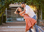 Happy couple, dance and love in park, garden and sunshine for bonding, quality time and romantic date together. Smile, dancing and fun man, woman and partner, freedom and happiness outdoors in summer