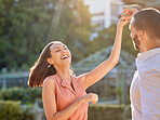Couple, happy and dance outdoor for love, care and support or relationship bonding together. Woman, dancing celebration with man and quality time or comic romance, happiness and smile in cityscape