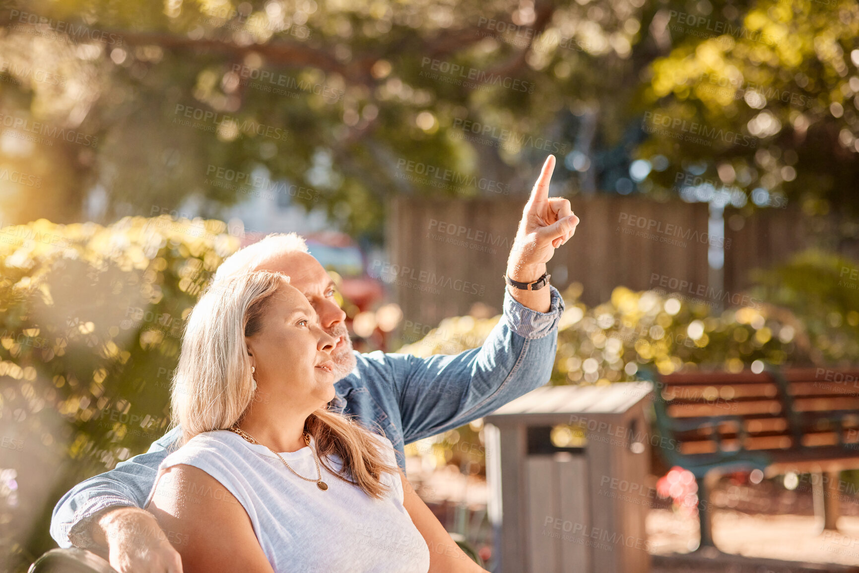 Buy stock photo Mature, couple and man and woman bonding in the park enjoying the view while relaxing on a bench. Senior husband and wife bond in romantic relationship for a summer vacation with care and love