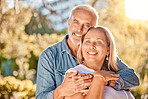 Mature couple, hug and bonding in nature park, environment garden or sustainability backyard for marriage anniversary, love or trust. Portrait, smile or happy man and middle aged woman in retirement