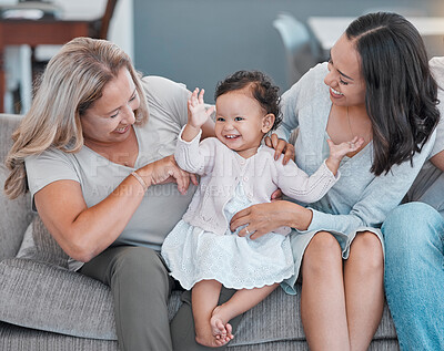 Buy stock photo Family home, love and baby, mother and grandmother with happiness on living room couch for love, care and fun while excited, happy and dancing. Generation of women on the sofa for support and pride