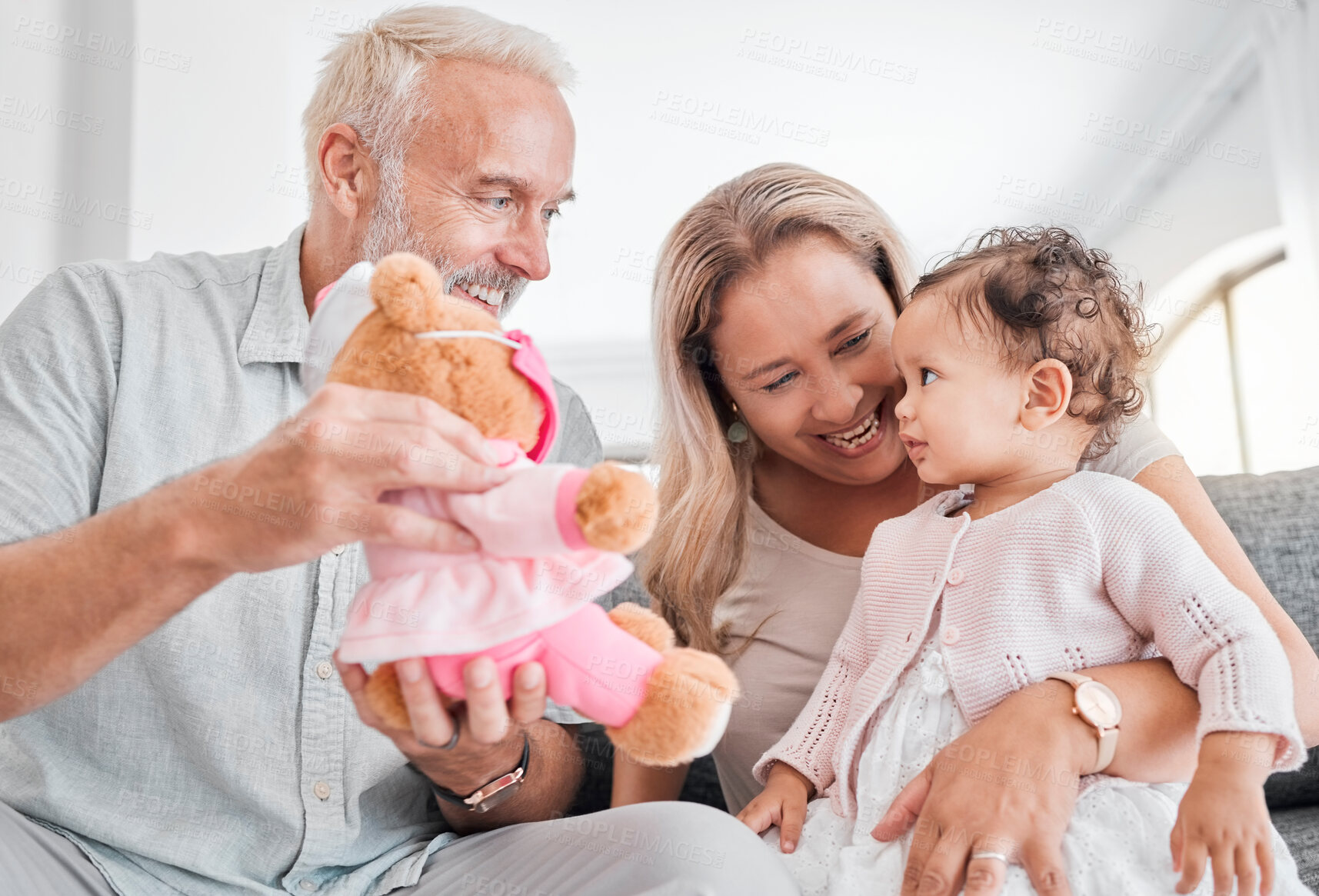 Buy stock photo Toy, grandparents and baby play, happy and smile together in family home. Family, teddy bear and senior people with girl kid, development and child bonding with happiness, love and care in house