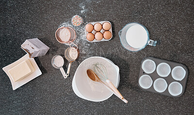 Buy stock photo Top view, baking product and kitchen counter with eggs, flour and butter utensils on table. Food and cooking ingredients on a table to bake meal or dessert with protein and nutrients from above