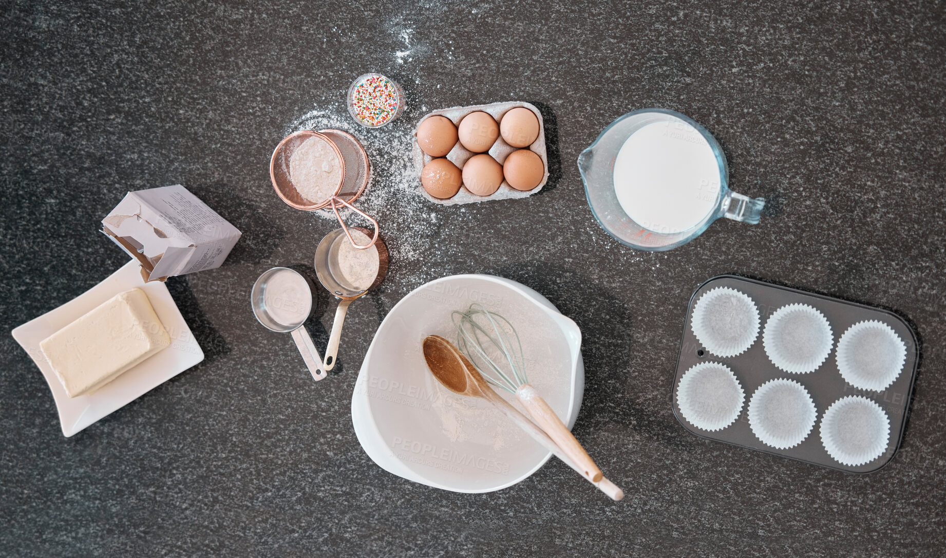 Buy stock photo Top view, baking product and kitchen counter with eggs, flour and butter utensils on table. Food and cooking ingredients on a table to bake meal or dessert with protein and nutrients from above