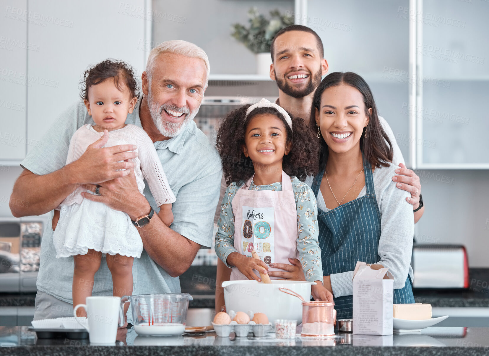 Buy stock photo Big family, portrait and children learning baking from parents and grandfather in the kitchen of their house. Food, happy and kids, senior man and mother and father cooking with smile together