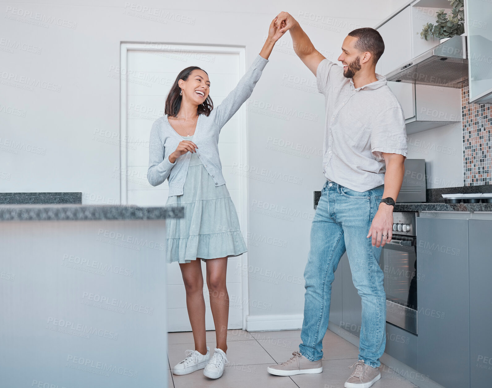 Buy stock photo Happy couple, dancing and celebration for new home, love or marriage while together in kitchen for care, fun and energy for happiness. Man and woman in house for romantic dance and quality time