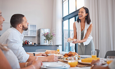 Buy stock photo Family, friends and woman serving lunch for celebration of Christmas, birthday or weekend time. Happy family, men and women smile at table eating and drinking together at dinner with home cooking.