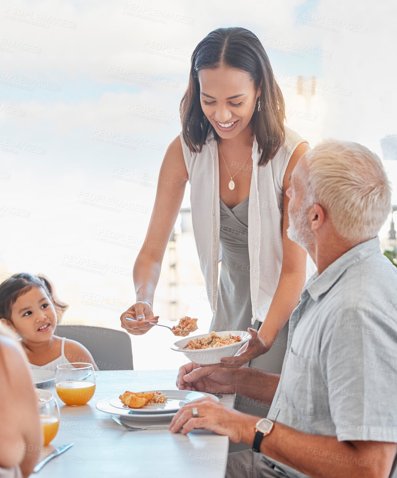 Buy stock photo Family, lunch and woman serve food to father in the family home at the dining table for nutrition, diet and wellness. Meal, mother and daughter eating meal with grandfather at home for bonding 