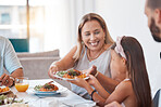 Food, family and children with a mother and daughter eating a meal around a dinner table for celebration. Health, diet and nutrition with a woman and girl enjoying lunch together in their home