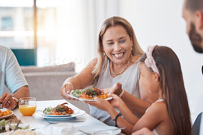 Buy stock photo Food, family and children with a mother and daughter eating a meal around a dinner table for celebration. Health, diet and nutrition with a woman and girl enjoying lunch together in their home