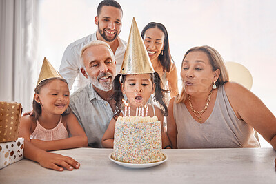 Buy stock photo Girl, birthday cake and candles for happy family at party, celebrate or together in home. Child, black family and celebration with cake, birthday party or event in house with happy birthday surprise