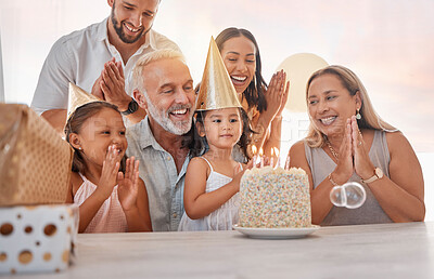 Buy stock photo Family, birthday party and cake with celebration, clapping and singing with candle or gift on table in home. Girl, parents and grandparents with sister celebrate event in house with birthday cake