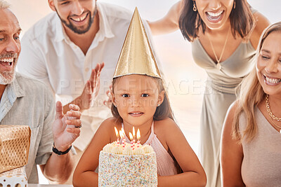 Buy stock photo Birthday, candles on birthday cake and child with big family celebrate party event, sing together and show girl love in apartment home. Happy mother, father and child bonding with grandparents smile 