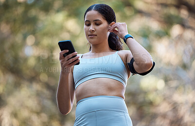 Buy stock photo Fitness, earphones and woman with phone in nature for running music, radio or podcast outdoors. Health, wellness and female with 5g mobile smartphone streaming audio, song or sound on training break.