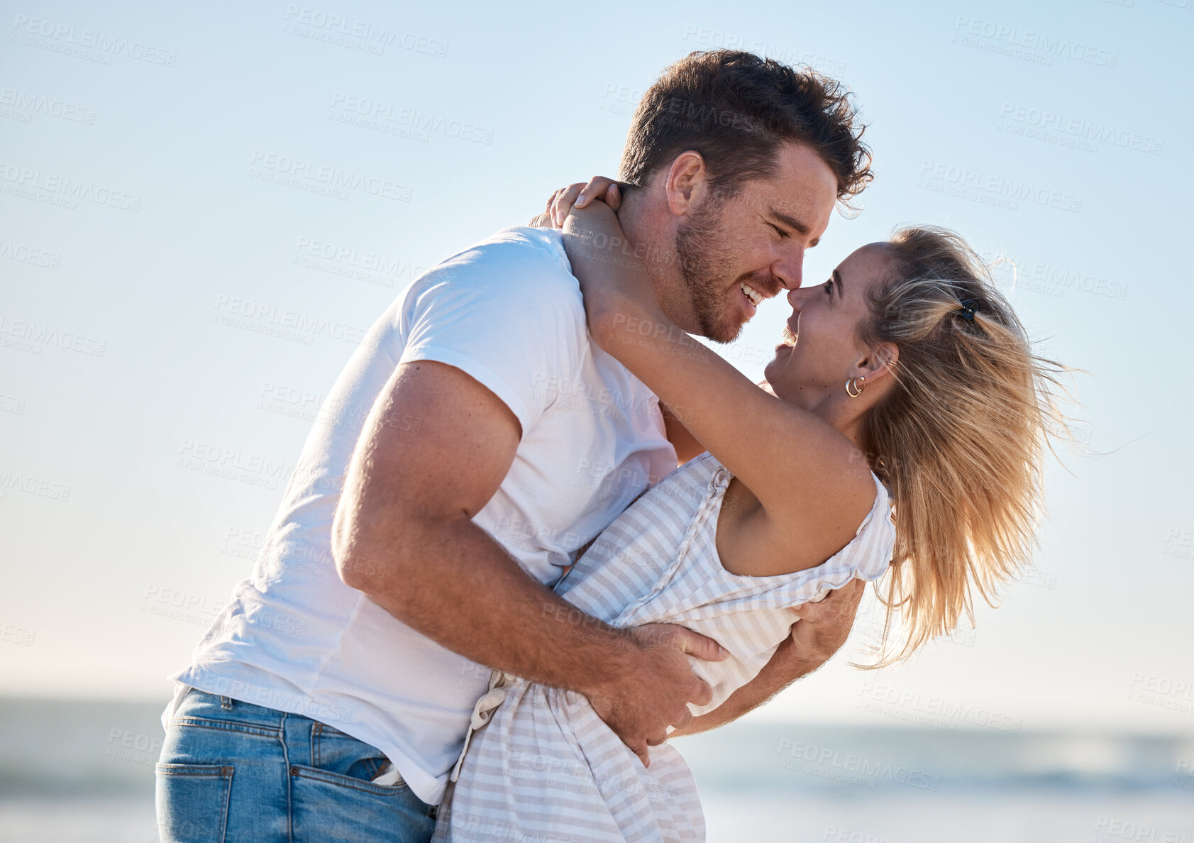 Buy stock photo Couple, hug and love, happy at the beach with relationship and romance for bonding and together outdoor by the ocean. Romantic, care and travel date with man and woman hugging and quality time.