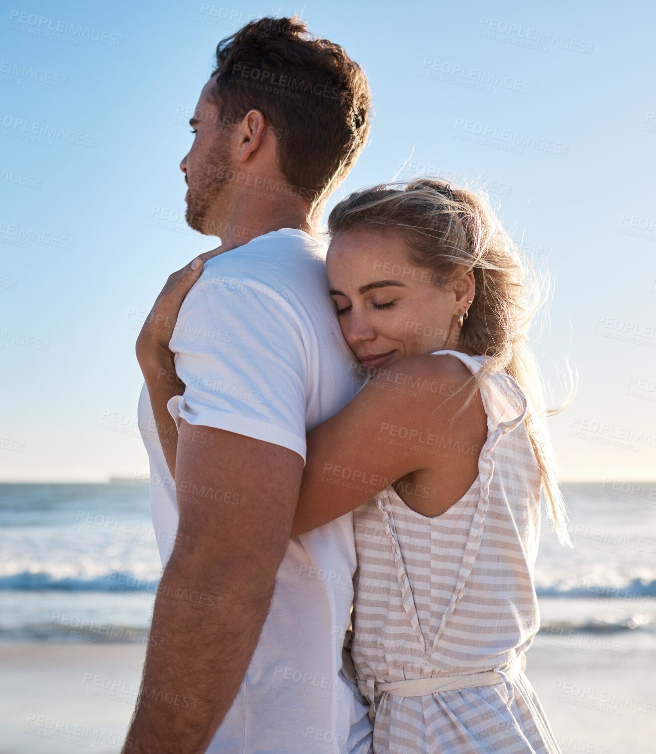 Buy stock photo Hug, love and beach with a young couple enjoying a date in nature together for romance or vacation. Summer, travel and hugging with a man and woman dating on a coast holiday by the sea or ocean