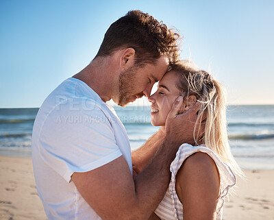 Buy stock photo Happy, love and couple at the beach while on holiday or romantic summer travel honeymoon in greece. Smile, care and calm man and woman in romance, hug and bonding in nature by the ocean on vacation