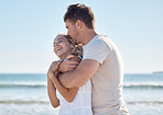 Beach, blue sky and love couple hug, relax and enjoy ocean freedom, peace or fun time on outdoor adventure date. Nature sea, happy marriage bond and romantic man and woman on travel in Toronto Canada