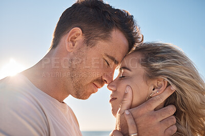 Buy stock photo Couple, head touch and love at beach in closeup with romance, care and happiness for relationship. Man, woman and face together for care, bonding and together by ocean for vacation, holiday or summer