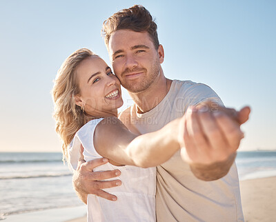 Buy stock photo Couple, portrait smile and hug for love, care or support in summer vacation bonding together at the beach. Happy man and woman holding hands smiling for relationship holiday break by the ocean coast