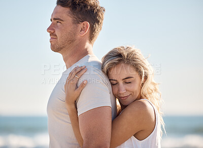 Buy stock photo Couple, hug and love bonding on beach by ocean or sea in trust, support or security on summer holiday in tropical Bali travel location. Smile, happy or embrace for man and woman on nature honeymoon