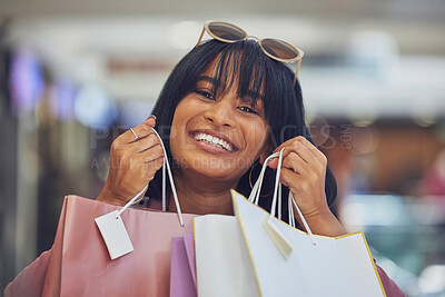 Buy stock photo Shopping, retail and portrait of black woman in mall holding shopping bags and smile on face. Customer, luxury lifestyle and happy female after buying clothing, cosmetics and products at store