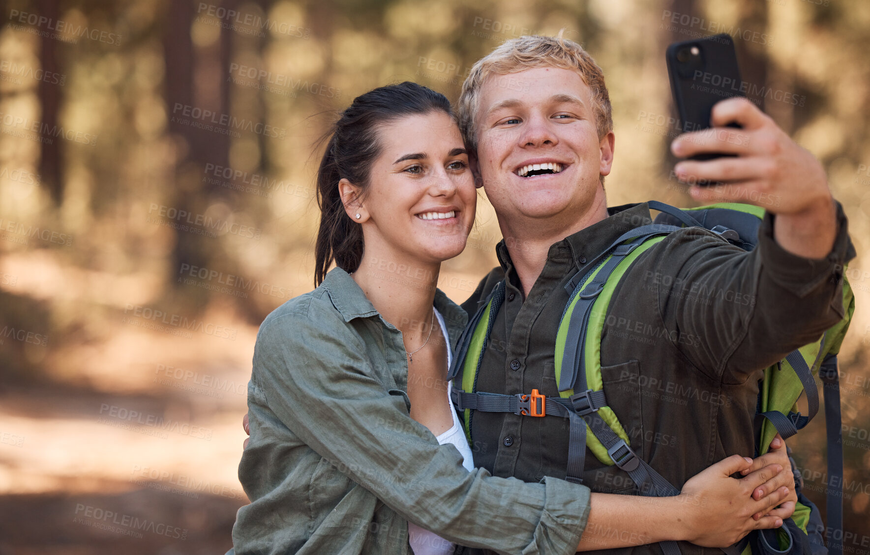 Buy stock photo Couple, phone selfie and hiking in nature on holiday or summer vacation. Travel, man and woman enjoying quality time together with 5g mobile smartphone on social media, picture post or happy memory.