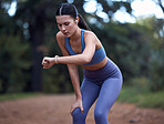 Woman, earphones or fitness smart watch check in nature exercise, sustainability environment workout or forest trail training. Runner, sports athlete or person with clock time or health radio podcast