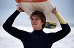 Ocean, surfer and man carrying surfboard on holiday, vacation or summer trip in Hawaii. Fitness, workout and happy male athlete with board after surfing, water sports and training exercise by sea.
