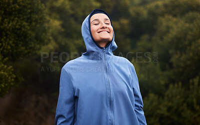 Buy stock photo Nature, happiness and woman with raincoat, smile and wellness standing in outdoor park. Peace, calm and girl enjoying natural environment, spring and fresh air hiking, walking and exercise in forest