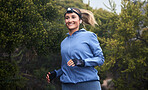 Fitness, nature and woman running on a trail for cardio workout in the woods or green garden. Health, wellness and young woman from Canada training for sports marathon, race or competition in forest.