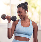 Woman, dumbbell and music earphones in gym workout, training and exercise for strong arm muscles, body goals or strength target. Indian athlete, personal trainer or fitness coach weightlifting metal
