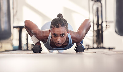 Buy stock photo Dumbbell, fitness and black woman training, workout or bodybuilder in gym floor portrait for body goals, muscle and wellness motivation. Strong, power and sports girl doing push up exercise with gear