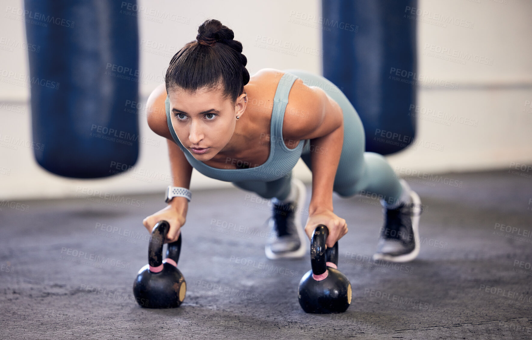 Buy stock photo Exercise, kettlebell plank and woman focus on fitness, body transformation goals or health wellness. Workout motivation, sports challenge determination and athlete training on boxing gym floor