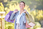 Retail, shopping bag and happy with portrait of woman spending for luxury, sales and fashion spree. Gift, products and boutique with customer buying clothes for consumer, retail therapy and store