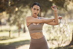 Woman, park portrait and stretching for exercise, workout or running with smartwatch, outdoor and focus. Runner, warm up and wellness in summer sunshine for workout, fitness and training for health