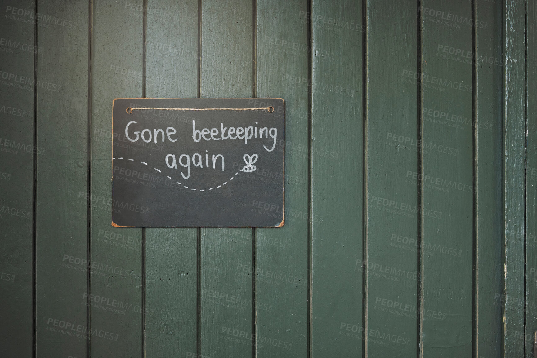 Buy stock photo Door, sign and beekeeping with a chalkboard hanging on an entrance way of a small business in agriculture. Wood, store and retail with a notice on a wooden surface for farming or sustainability